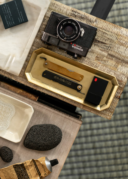 Vintage camera and other vintage items on a textured surface