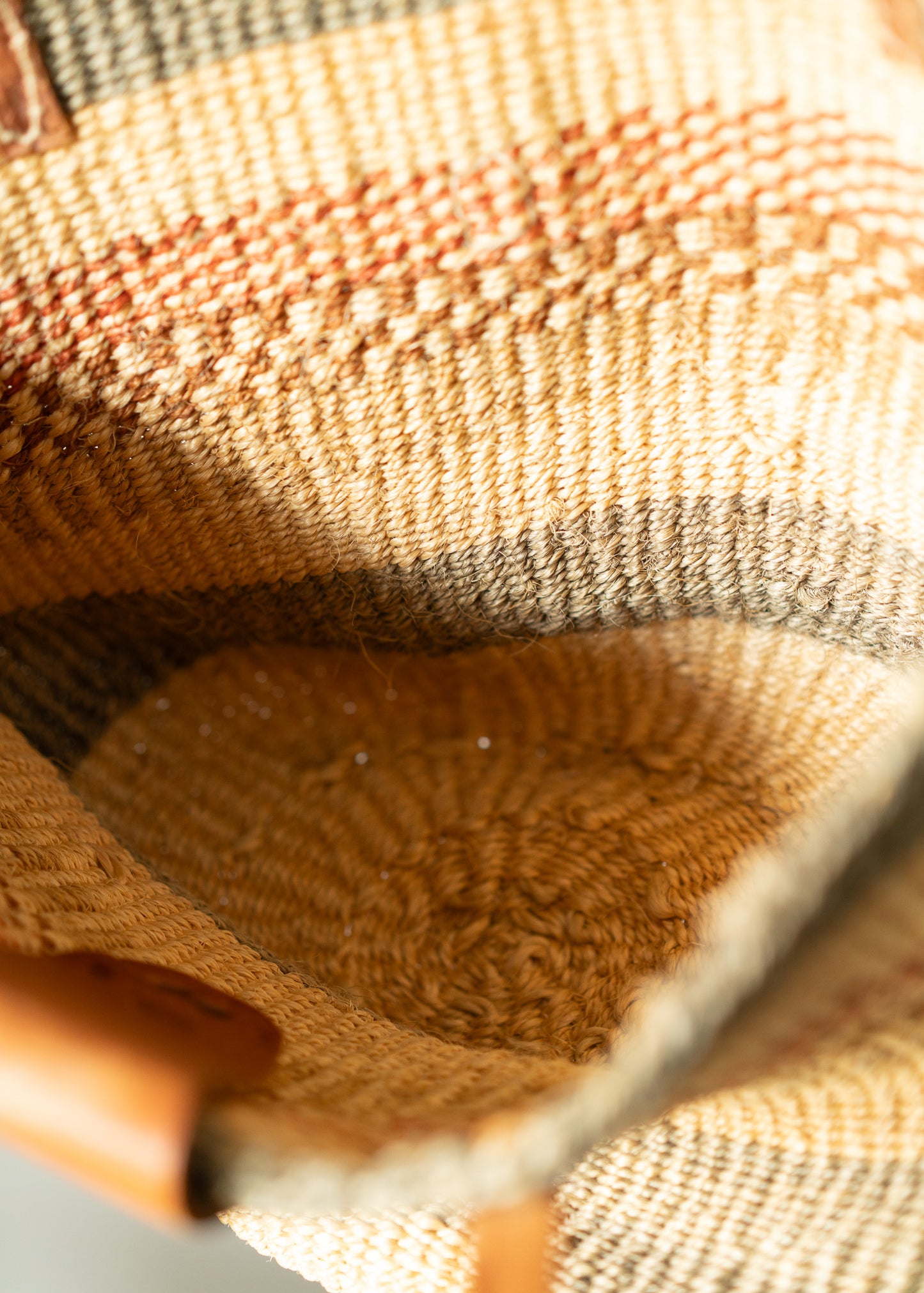 Close-up of a woven basket with a focus on texture and color gradient.