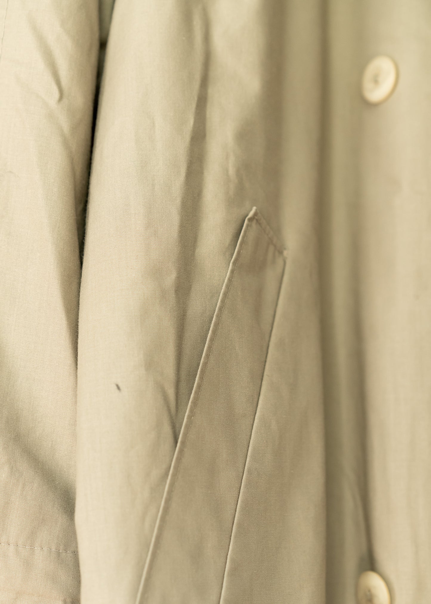 close up of a beige trench coat