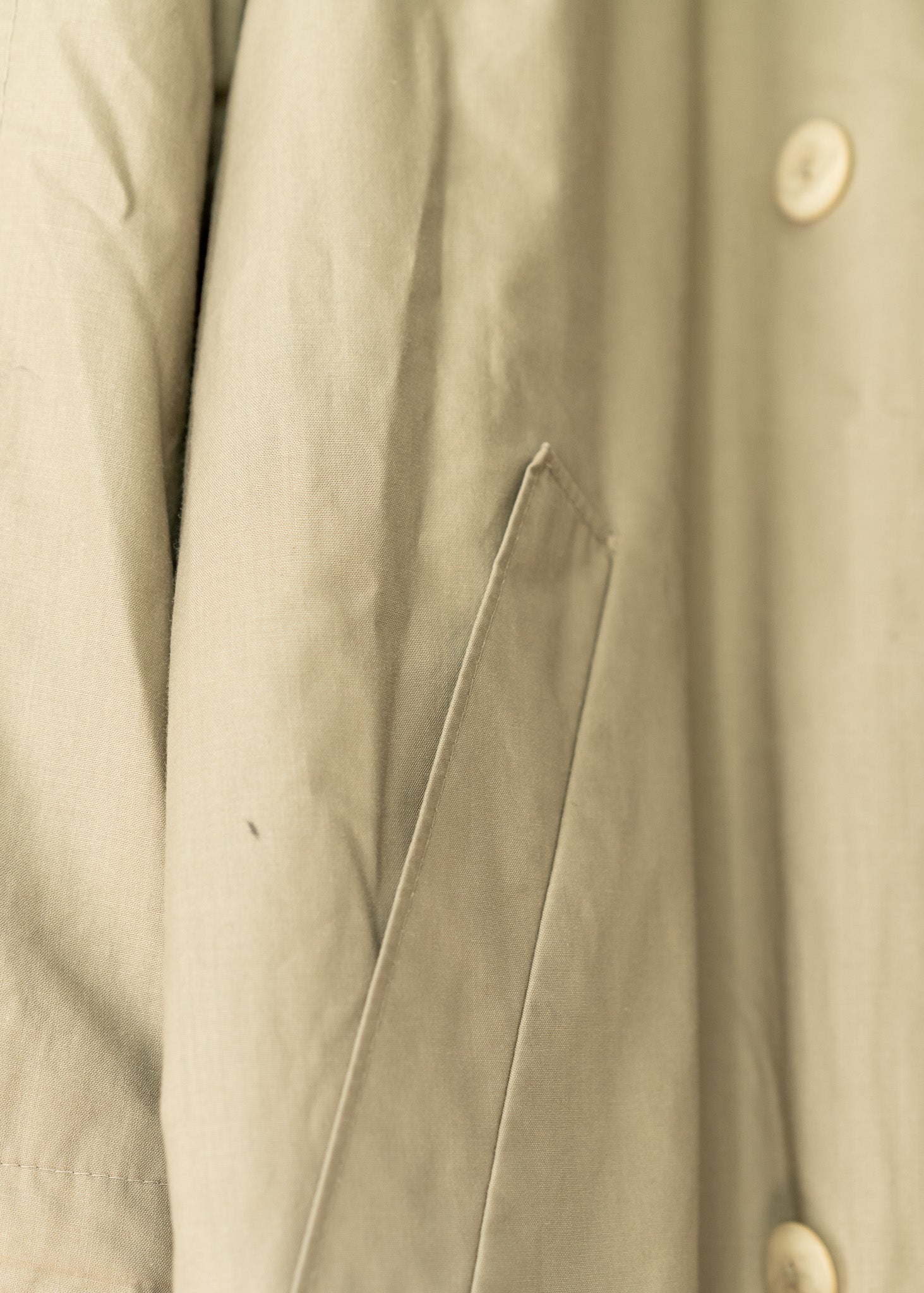 close up of a beige trench coat