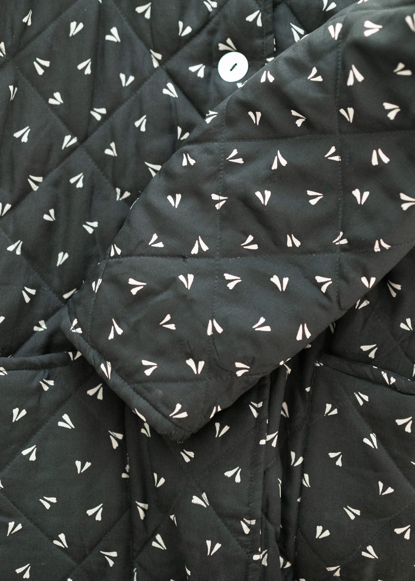 vintage black quilted silk fabric with white geometric pattern