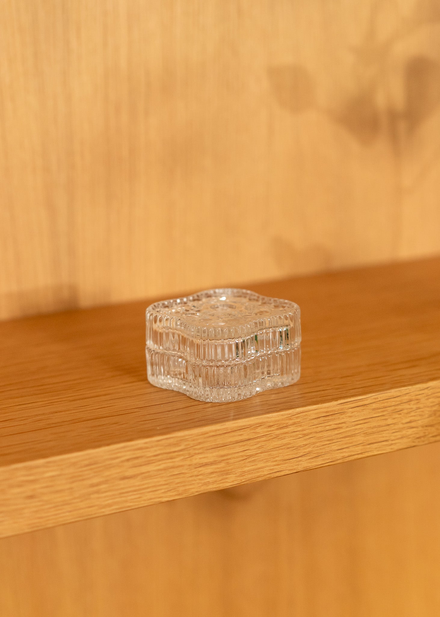 vintage clear glass square container on a wooden surface