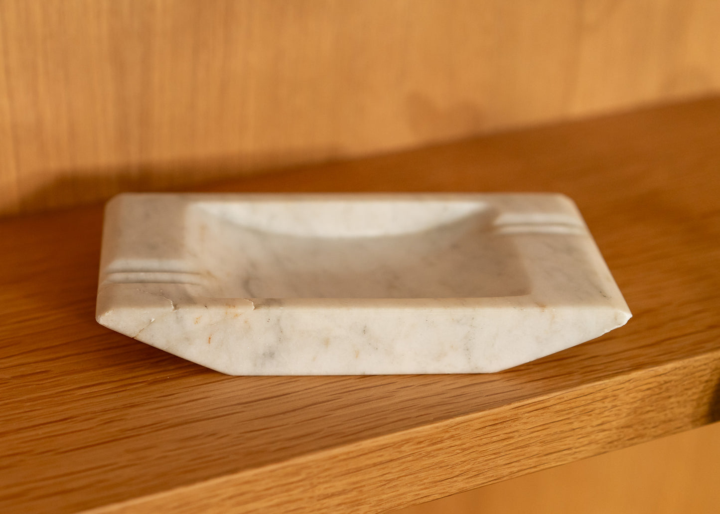 Rectangular vintage onyx stone vessel on a wooden surface