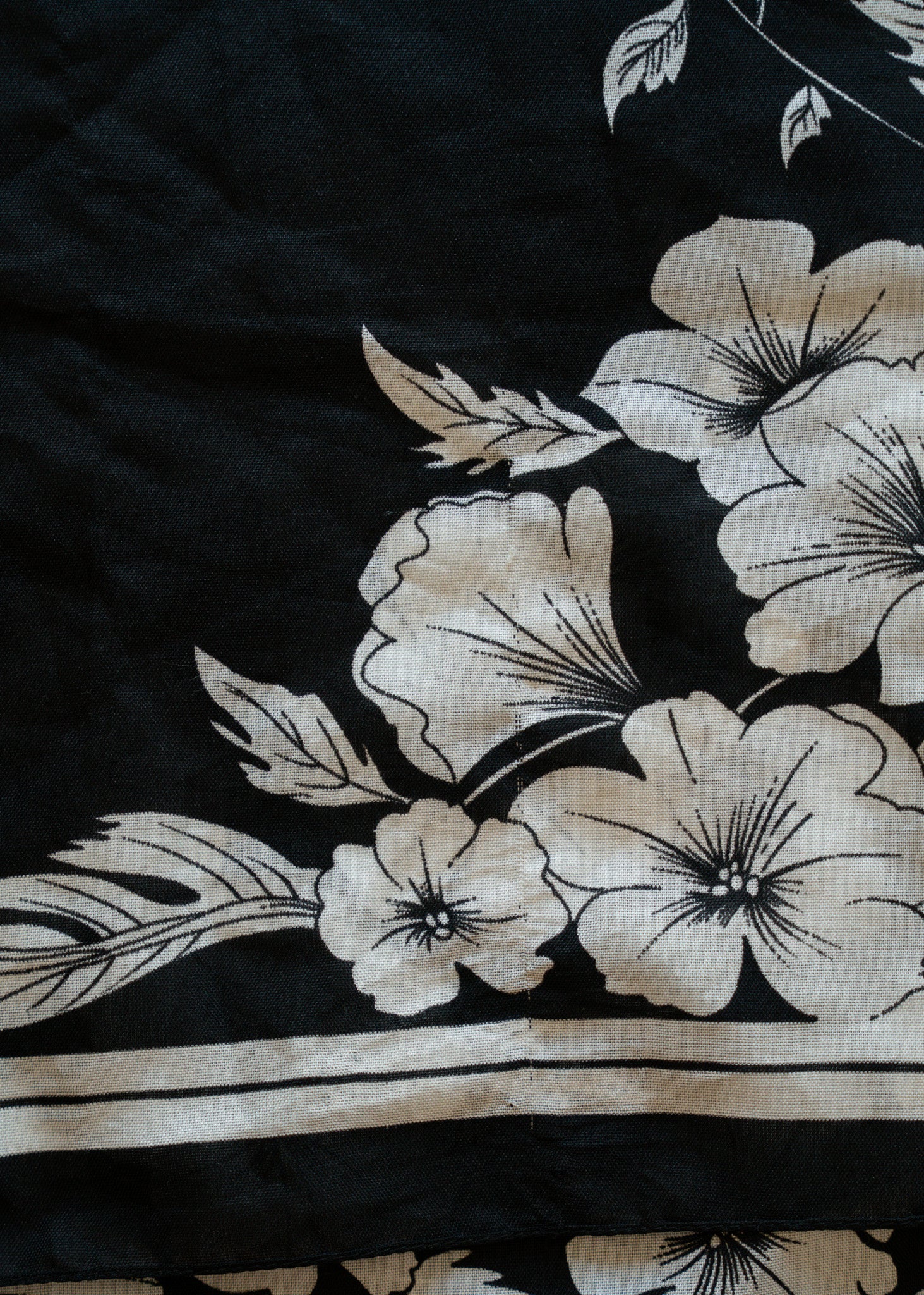 Black fabric with white floral patterns